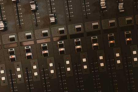 top view of analog graphic equalizer at recording studio