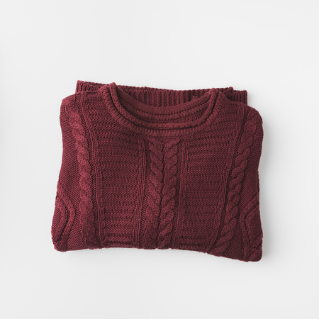 top view of trendy marsala knitted sweater, isolated on whiteの写真素材