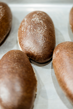 close-up shot of rye buns on baking tray