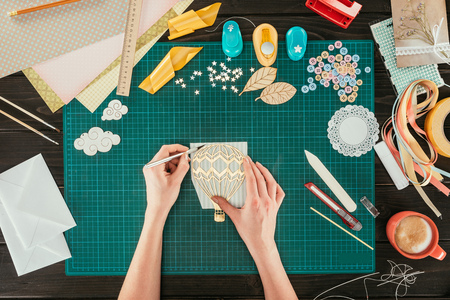 cropped image of woman making sketch of balloon with pencilの写真素材
