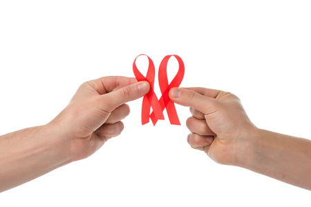 cropped shot of gay couple with aids ribbons isolated on whiteの写真素材