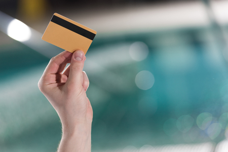 cropped shot of man holding credit card in spa centerの写真素材