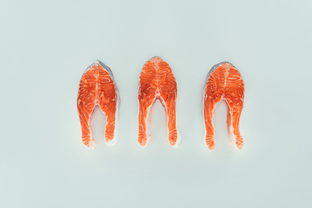 close-up view of healthy organic salmon slices isolated on greyの写真素材