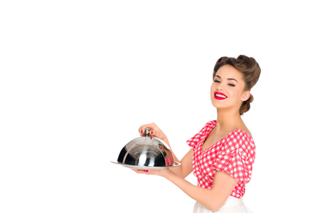 beautiful smiling woman in retro clothing with serving tray in hands isolated on whiteの写真素材