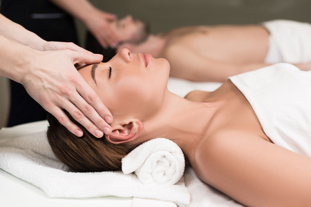 close-up partial view of young couple having massage in spa salonの写真素材