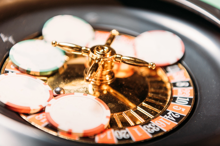 selective focus of roulette and casino chips in casinoの写真素材