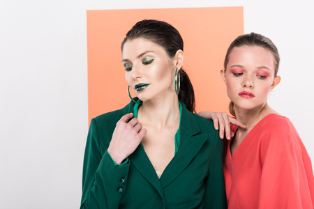 beautiful fashionable young women with eyes closed posing with living coral on backgroundの写真素材