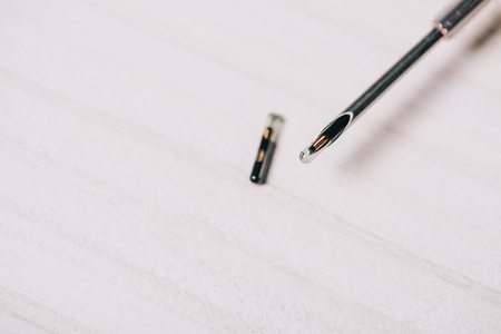 close up of microchip and tool on grey tableの写真素材