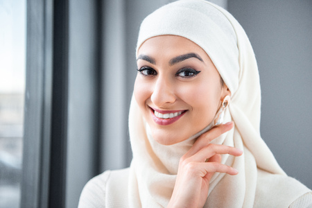 portrait of beautiful happy young muslim woman smiling at cameraの写真素材