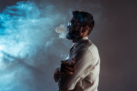 handsome bearded man smoking cigarの写真素材