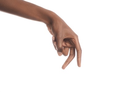 cropped view of african american man tiptoeing with fingers isolated on whiteの写真素材