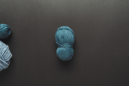 top view of blue knitting clews on grey tabletopの写真素材