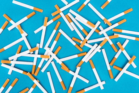 Top view of cigarettes isolated on blueの写真素材