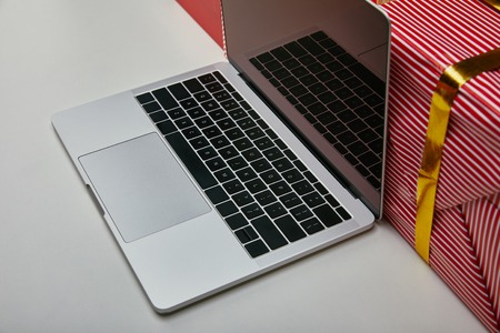 Cropped view of opened laptop with black laptop keyboard