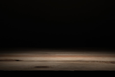 brown striped wooden surface on blackの写真素材