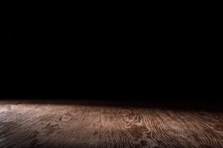 brown striped wooden background on blackの写真素材