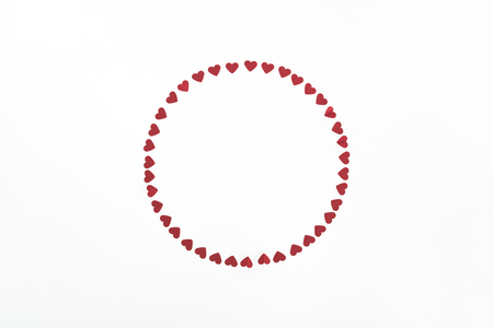 elevated view of circle made of red heart symbols isolated on white, st valentine day conceptの写真素材