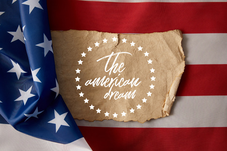 vintage crumpled paper with the american dream lettering and stars on american flag