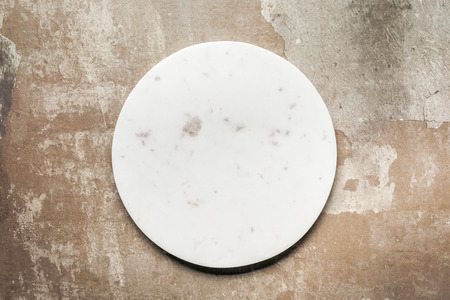 white ceramic plate on rustic background with copy spaceの写真素材