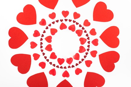 elevated view of circles made of red heart symbols isolated on white, st valentine day conceptの写真素材