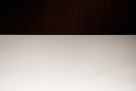 empty white textured table isolated on blackの写真素材