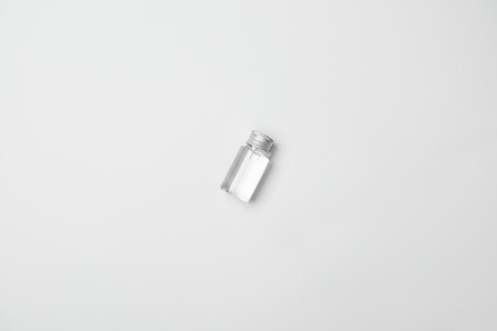 Top view of transparent cometic bottle on white background with copy spaceの写真素材