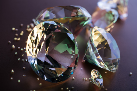 selective focus of pure diamonds on brown backgroundの写真素材
