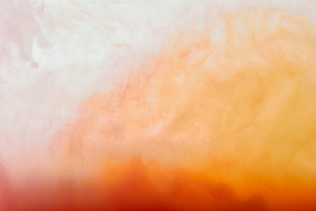 abstract texture with white and orange swirls of paintの写真素材