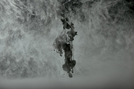 Background with black and white swirls of paintの写真素材