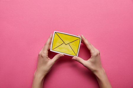 top view of yellow email sign on pink backgroundの写真素材