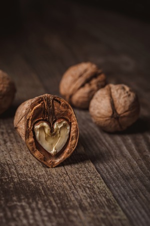 Close up view of natural walnuts on wooden tabletopの写真素材