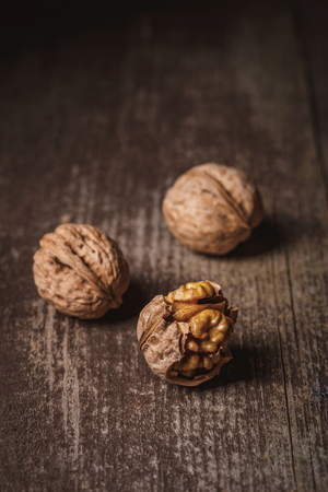 Close up view of natural walnuts on wooden tabletopの写真素材