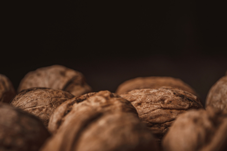 Close up view of walnuts on black backdropの写真素材