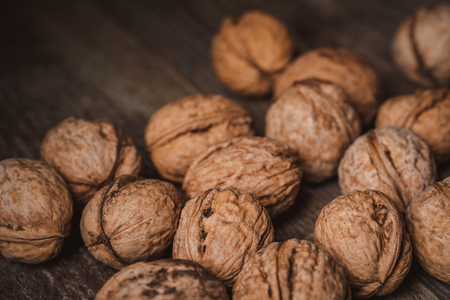 Close up view of walnuts on wooden tabletopの写真素材