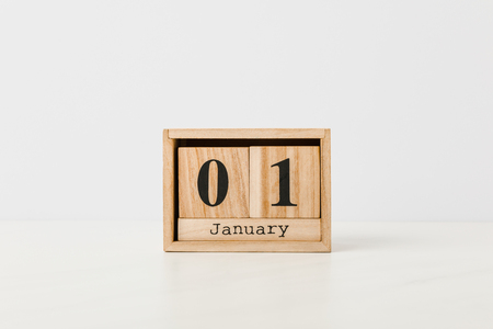 Close-up view of wooden calendar with 01 January on white backgroundの写真素材