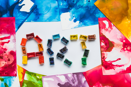 top view of watercolor abstract drawings and art lettering made of paintsの写真素材