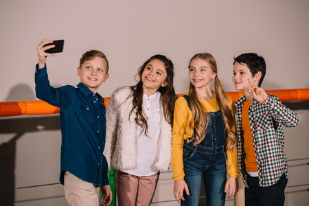 Group of preteen friends making selfie with smileの写真素材