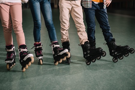 Partial view of children legs in roller skatesの写真素材