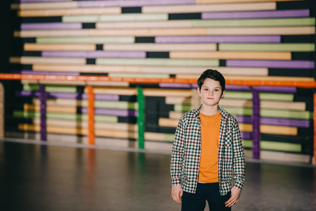 Selective focus of cute boy with colorful backgroundの写真素材