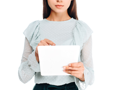 partial view of woman using tablet isolated on whiteの写真素材
