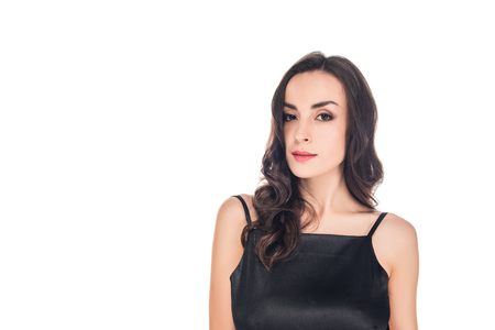 portrait of woman posing in black dress isolated on whiteの写真素材