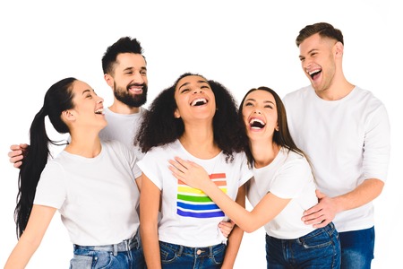 milticultural group of young people laughing with african american woman with lgbt sign on t-shirt isolated on whiteの写真素材
