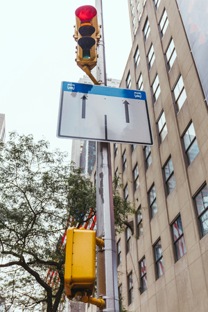 urban scene with buildings, traffic light and road sign in new york city, usaの写真素材