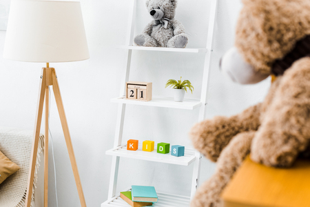 modern interior of nursery room with rack and toysの写真素材