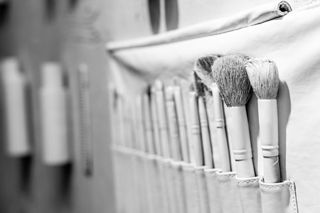 selective focus of decorative white brushes in beauty salonの写真素材