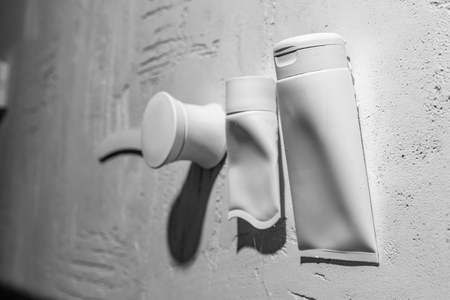 close-up view of decorative containers for cosmetics on wall in beauty salonの写真素材