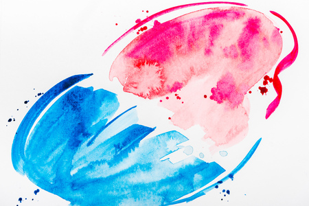 top view of pink and blue brushstrokes and spills on white paperの写真素材
