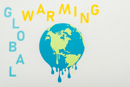 paper cut melting globe and "global warming"  inscription on grey backgroundの写真素材
