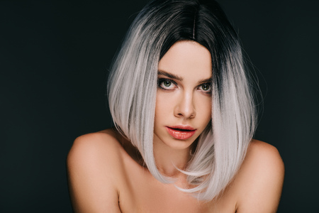 beautiful sensual girl posing in grey wig, isolated on blackの写真素材