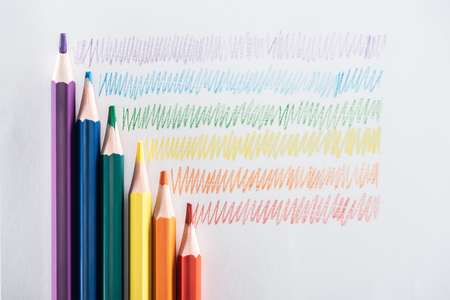 top view of rainbow multicolored pencils and strokes on grey background, lgbt conceptの写真素材